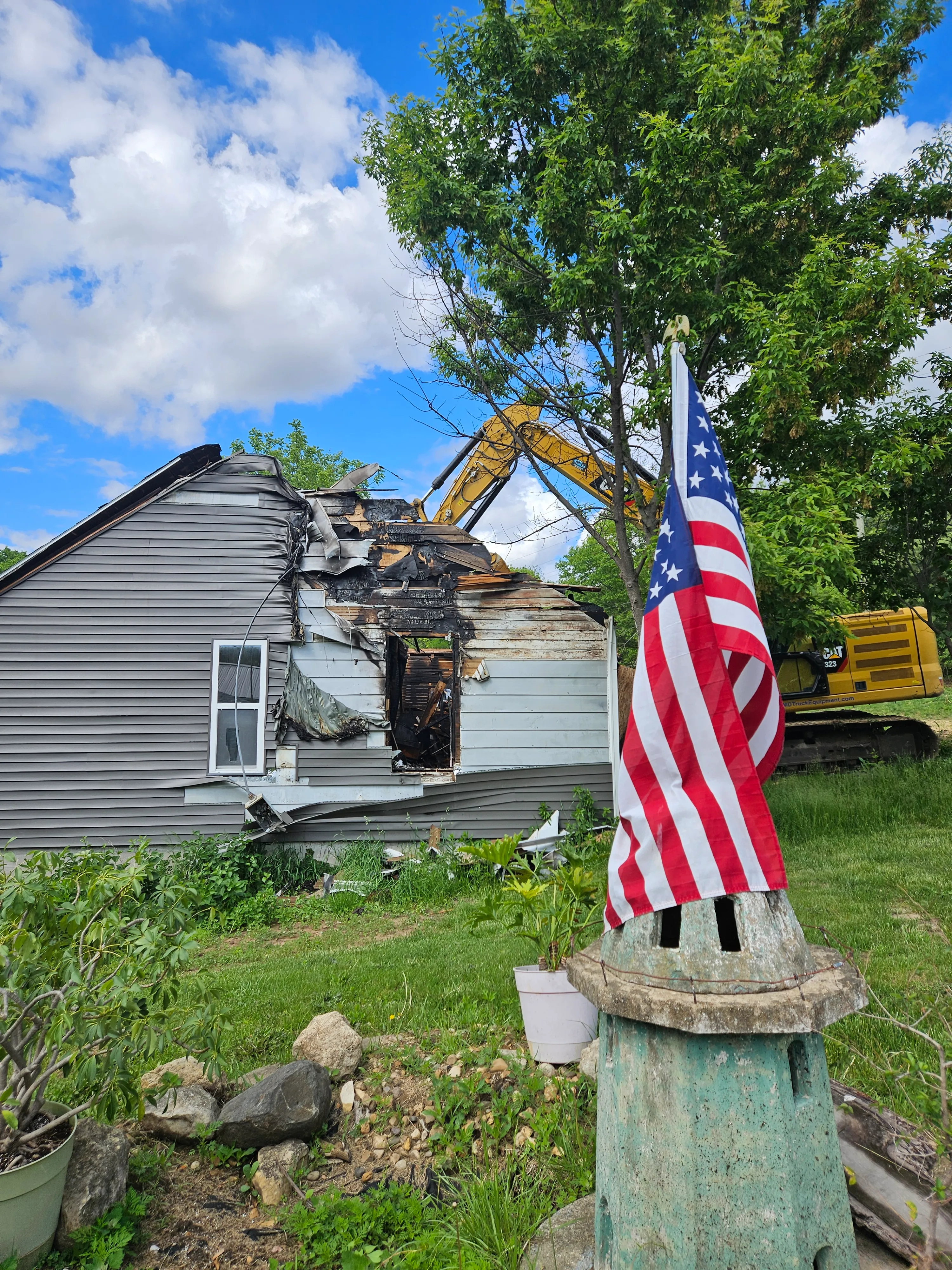 Excavator and Flag on Site